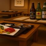 和食膳と共に並べられた海外ビール5本が映る日本風レストランの室内